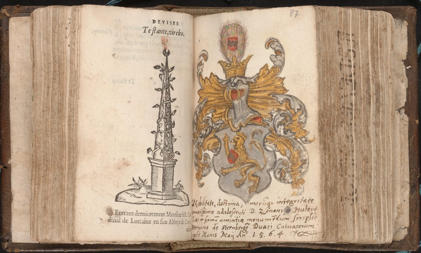 An open book, small and thick. The left page is printed, with a woodcut of an obelisk wound with ivy. On the right page a coat of arms is painted in gold, silver, and red above five lines of Latin handwriting.